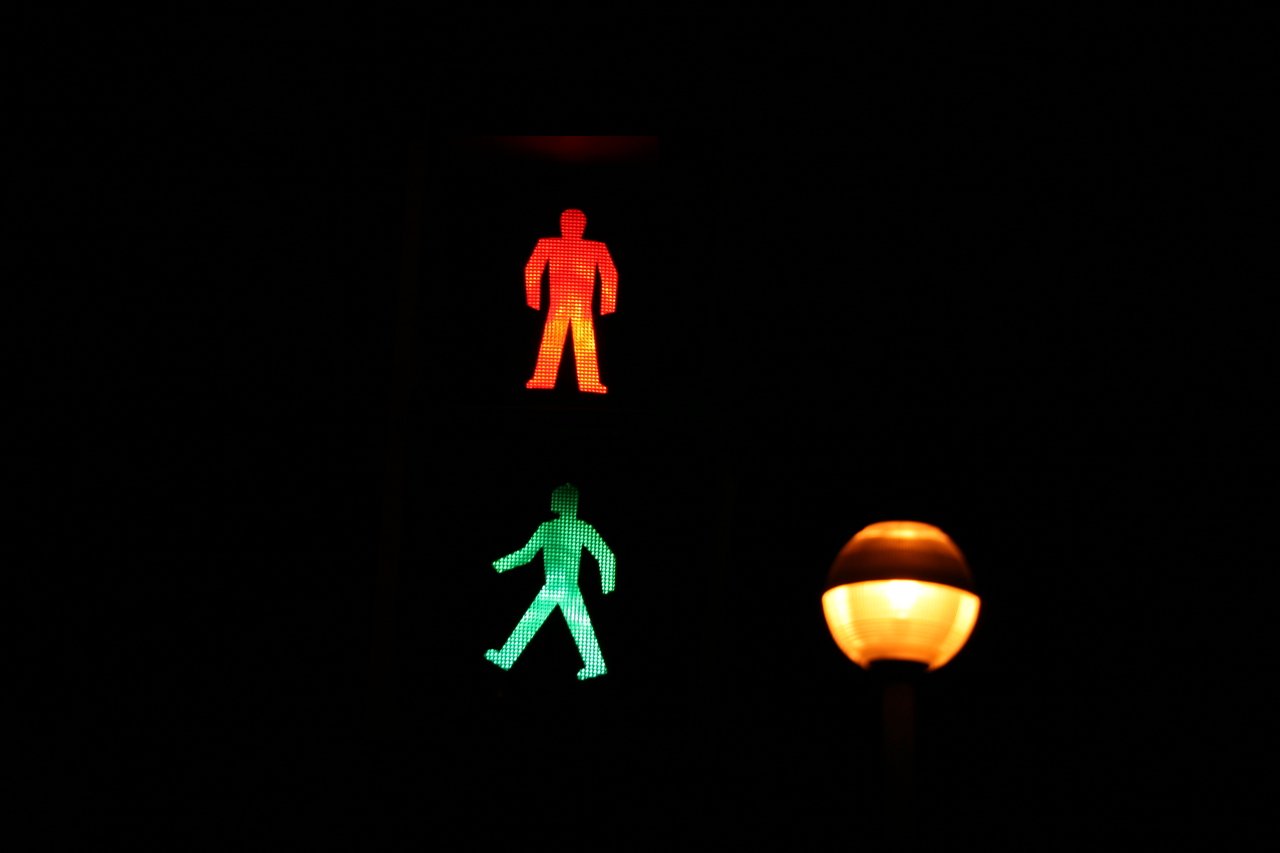Photo description: a pedestrian crossing light with both walk and don't walk on